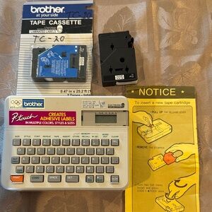 Brother P-touch PT-10 Label Maker with 2 white Tapes included